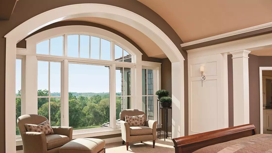 Bedroom featuring Large Windows with Arched Transom