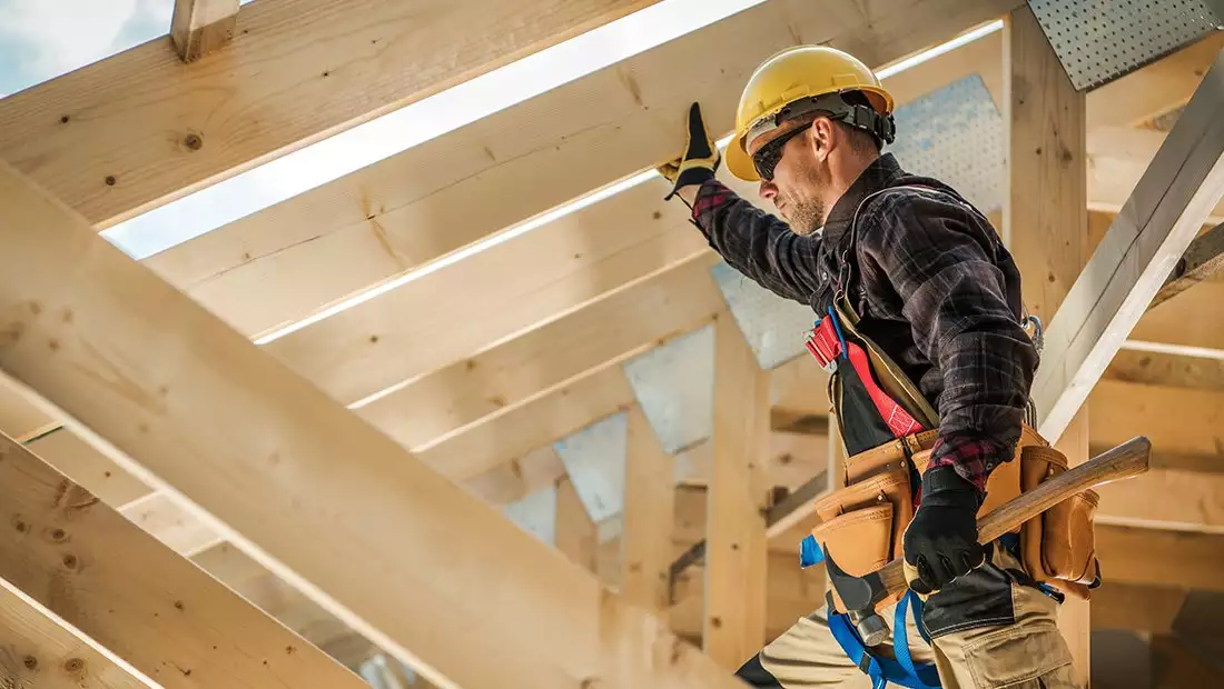 Worker Installing Roof Truss