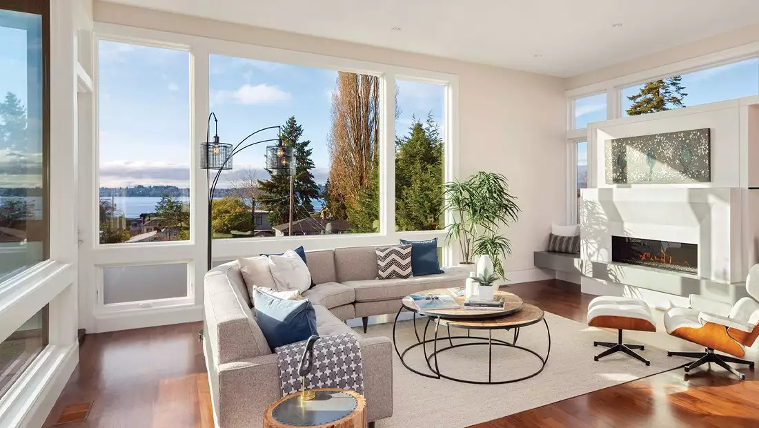 Living Area featuring Large Windows with a Lake View