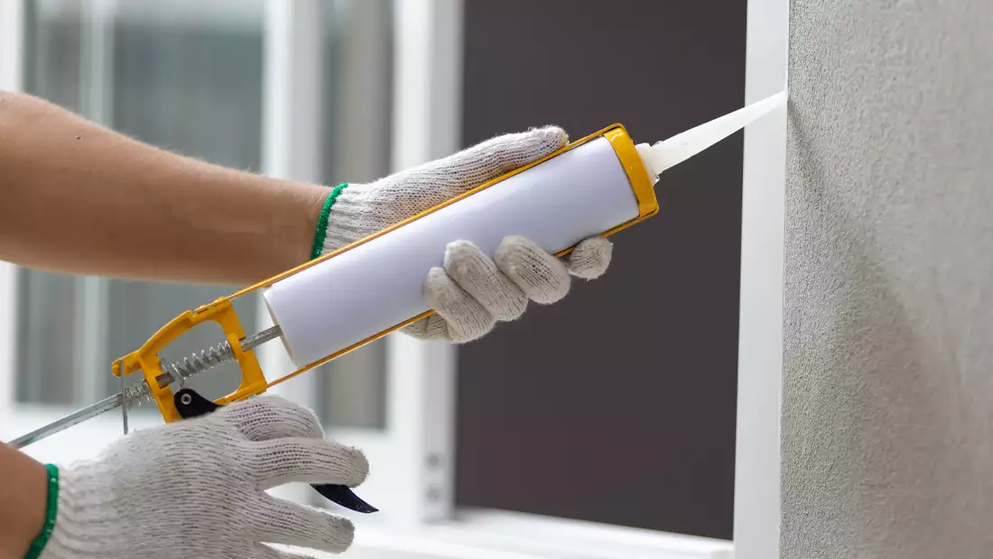 Window Exterior Being Caulked